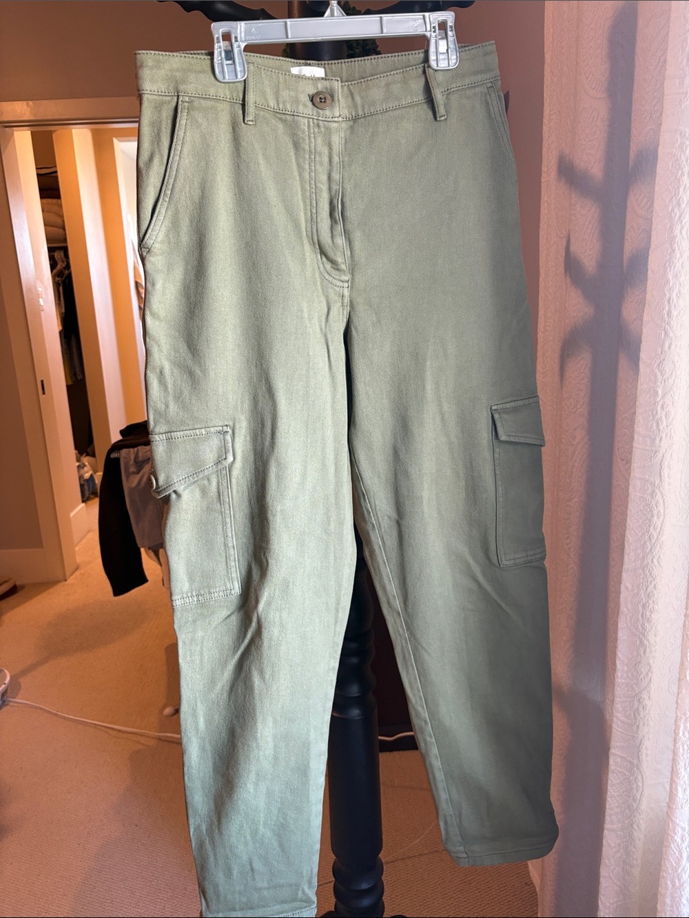 Aritzia cargo pants with adjustable clasp at the hem.